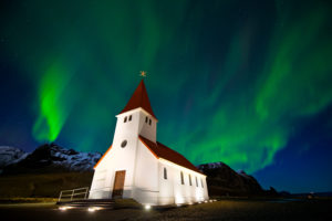 Northern Lights over the Vik Church at Colby Brown's Iceland Winter Photo Workshop